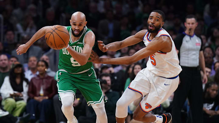 May 7, 2025; Boston, Massachusetts, USA; Boston Celtics guard Derrick White (9) and New York Knicks forward Mikal Bridges (25) work for the ball in the second quarter during game two of the second round for the 2025 NBA Playoffs at TD Garden. Mandatory Credit: David Butler II-Imagn Images