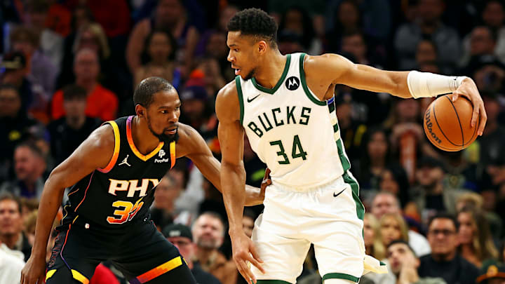 Feb 6, 2024; Phoenix, Arizona, USA; Milwaukee Bucks forward Giannis Antetokounmpo (34) handles the ball against the Phoenix Suns forward Kevin Durant (35) during the third quarter at Footprint Center. Mandatory Credit: Mark J. Rebilas-Imagn Images