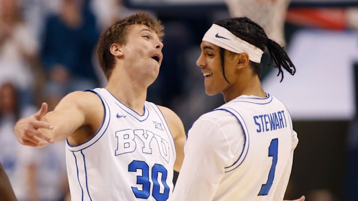 Dallin Hall and Trey Stewart celebrate as the Cougars take down West Virginia.