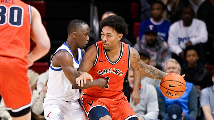 Jan 17, 2026; Dallas, Texas, USA; Virginia Cavaliers guard Malik Thomas (1) looks to move the ball past SMU Mustangs guard Boopie Miller (2) during the second half at Moody Coliseum. Mandatory Credit: Jerome Miron-Imagn Images
