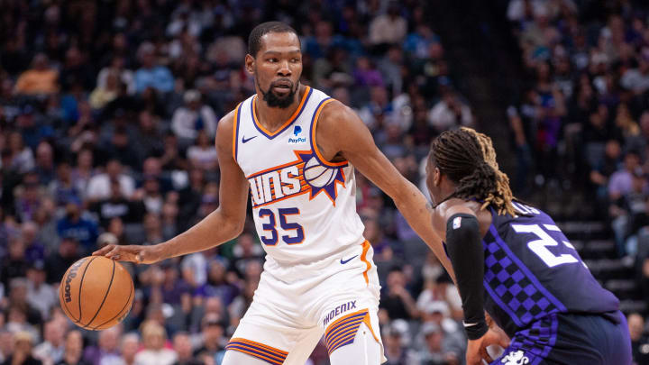 Apr 12, 2024; Sacramento, California, USA; Phoenix Suns forward Kevin Durant (35) controls the ball against Sacramento Kings guard Keon Ellis (23) during the second quarter at Golden 1 Center. Mandatory Credit: Ed Szczepanski-USA TODAY Sports Apr 12, 2024; Sacramento, California, USA; Phoenix Suns forward Kevin Durant (35) controls the ball against Sacramento Kings guard Keon Ellis (23) during the second quarter at Golden 1 Center. Mandatory Credit: Ed Szczepanski-USA TODAY Sports