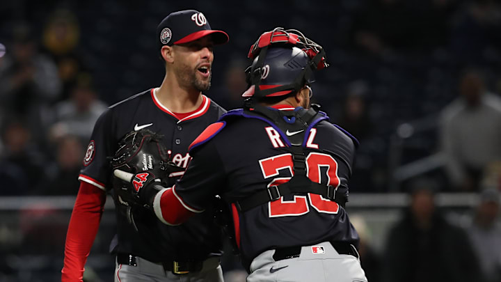 Apr 16, 2025; Pittsburgh, Pennsylvania, USA;  Washington Nationals relief pitcher Jorge Lopez (21) is restrained by catcher Keibert Ruiz (20) as Lopez has words with Pittsburgh Pirates right fielder Andrew McCutchen (not pictured) during the seventh inning at PNC Park. 