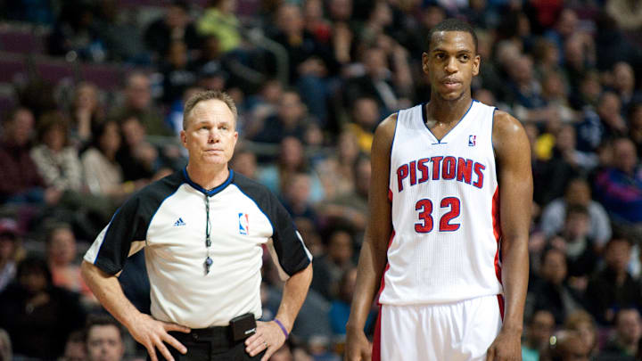 Feb 23, 2013; Auburn Hills, MI, USA; Detroit Pistons small forward Khris Middleton (32) and referee Bill Spooner (22) during the fourth quarter against the Indiana Pacers at The Palace. Pacers win 90-72. Mandatory Credit: Tim Fuller-Imagn Images