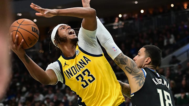 Apr 27, 2025; Milwaukee, Wisconsin, USA; Indiana Pacers center Myles Turner (33) take a shot against Milwaukee Bucks forward Kyle Kuzma (18) in the second quarter during game four of first round for the 2024 NBA Playoffs at Fiserv Forum. Mandatory Credit: Benny Sieu-Imagn Images Apr 27, 2025; Milwaukee, Wisconsin, USA; Indiana Pacers center Myles Turner (33) take a shot against Milwaukee Bucks forward Kyle Kuzma (18) in the second quarter during game four of first round for the 2024 NBA Playoffs at Fiserv Forum. Mandatory Credit: Benny Sieu-Imagn Images
