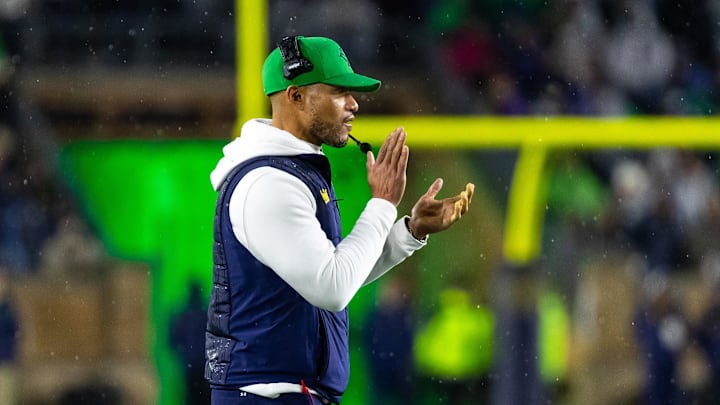 Nov 8, 2025; South Bend, Indiana, USA; Notre Dame Fighting Irish head coach Marcus Freeman claps after scoring against the Navy Midshipmen during the second half at Notre Dame Stadium. Mandatory Credit: Michael Caterina-Imagn Images