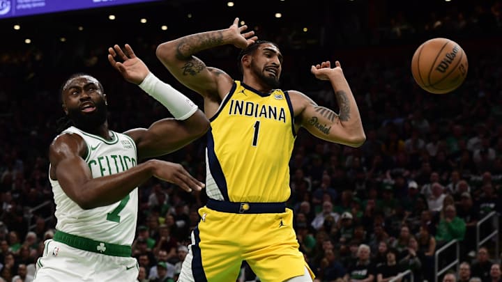 May 21, 2024; Boston, Massachusetts, USA; Boston Celtics guard Jaylen Brown (7) knocks the ball away from Indiana Pacers forward Obi Toppin (1) during the fist half for game one of the eastern conference finals for the 2024 NBA playoffs at TD Garden. Mandatory Credit: Bob DeChiara-USA TODAY Sports