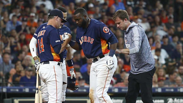 Aug 4, 2019; Houston, TX, USA; Houston Astros manager AJ Hinch (14) helps designated hitter Yordan Alvarez (44) to his feet after an apparent injury during the sixth inning against the Seattle Mariners at Minute Maid Park. Mandatory Credit: Troy Taormina-Imagn Images Aug 4, 2019; Houston, TX, USA; Houston Astros manager AJ Hinch (14) helps designated hitter Yordan Alvarez (44) to his feet after an apparent injury during the sixth inning against the Seattle Mariners at Minute Maid Park. Mandatory Credit: Troy Taormina-Imagn Images