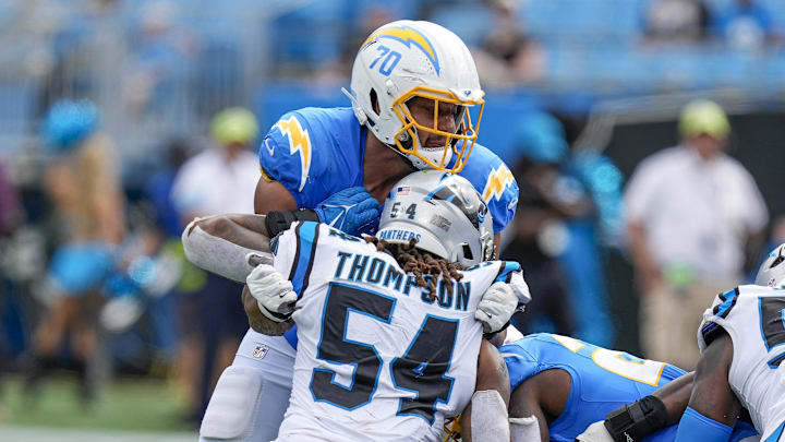 Sep 15, 2024; Charlotte, North Carolina, USA; Los Angeles Chargers offensive tackle Rashawn Slater (70) blocks Carolina Panthers linebacker Shaq Thompson (54) during the second half at Bank of America Stadium. Mandatory Credit: Jim Dedmon-Imagn Images
