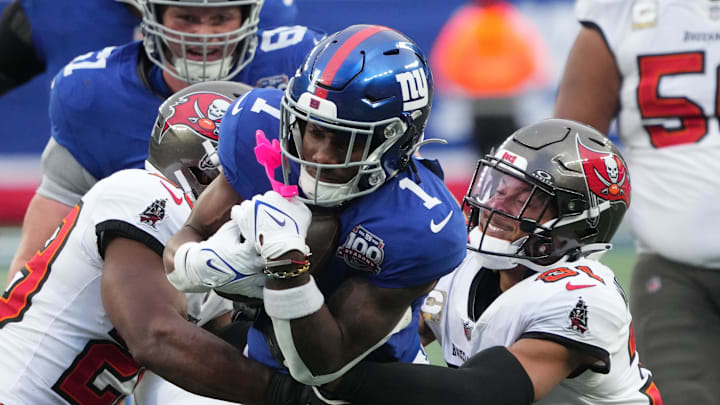 Nov 24, 2024; East Rutherford, New Jersey, USA; New York Giants wide receiver Malik Nabers (1) stopped by the Tampa Bay Buccaneers during the second half at MetLife Stadium. 