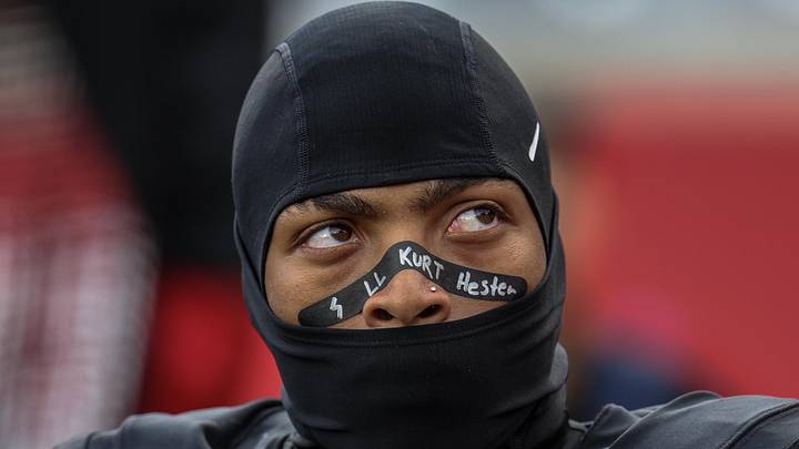 Nov 1, 2025; Houston, Texas, USA; Before the game against the West Virginia Mountaineers Houston Cougars running back DJ Butler (25) watches a replay board about coach  Kurt Hester at TDECU Stadium. The Houston Cougars' strength coach who died was Kurt Hester, the Director of Strength and Performance. Hester passed away on October 25, 2025, from stage IV melanoma after an eight-month battle with the diseaseMandatory Credit: Thomas Shea-Imagn Images