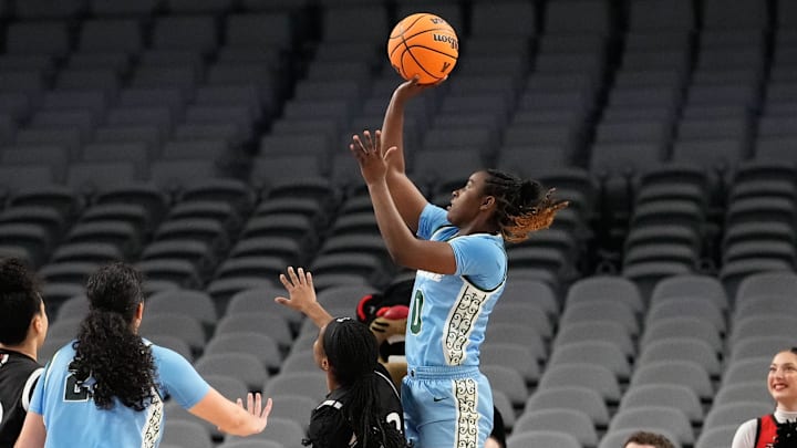 Mar 6, 2023; Fort Worth, TX, USA; Tulane Green Wave guard Kyren Whittington (0) scores a basket over Cincinnati Bearcats guard Mya Jackson (23) during the first half at Dickies Arena. 