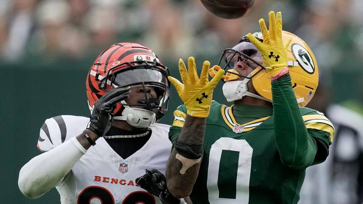 Green Bay Packers wide receiver Matthew Golden (0) makes a 35-yard reception while being covered by Cincinnati Bengals cornerback Cam Taylor-Britt (29) during the second quarter of their game Sunday, October 12, 2025 at Lambeau Field in Green Bay, Wisconsin.