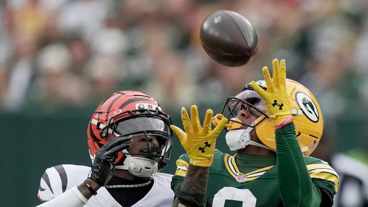 Green Bay Packers wide receiver Matthew Golden (0) makes a 35-yard reception while being covered by Cincinnati Bengals cornerback Cam Taylor-Britt (29) during the second quarter of their game Sunday, October 12, 2025 at Lambeau Field in Green Bay, Wisconsin.