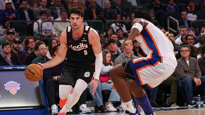 Portland Trail Blazers forward Deni Avdija (8) dribbles against New York Knicks forward OG Anunoby (8)