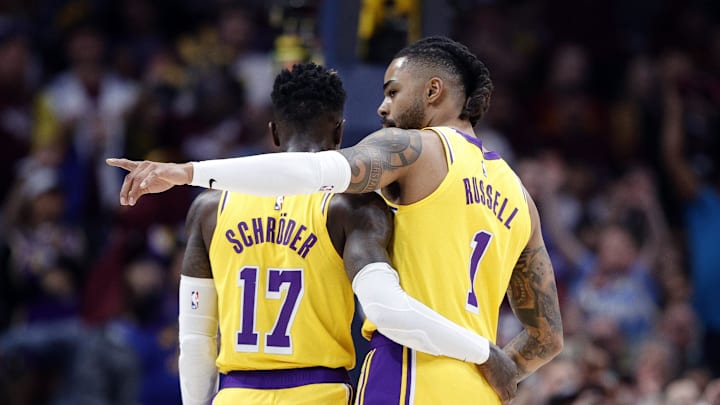 May 16, 2023; Denver, Colorado, USA; Los Angeles Lakers  guard D'Angelo Russell (1) and guard Dennis Schroder (17) embrace in the first quarter against the Denver Nuggets during game one of the Western Conference Finals for the 2023 NBA playoffs at Ball Arena. Mandatory Credit: Isaiah J. Downing-Imagn Images