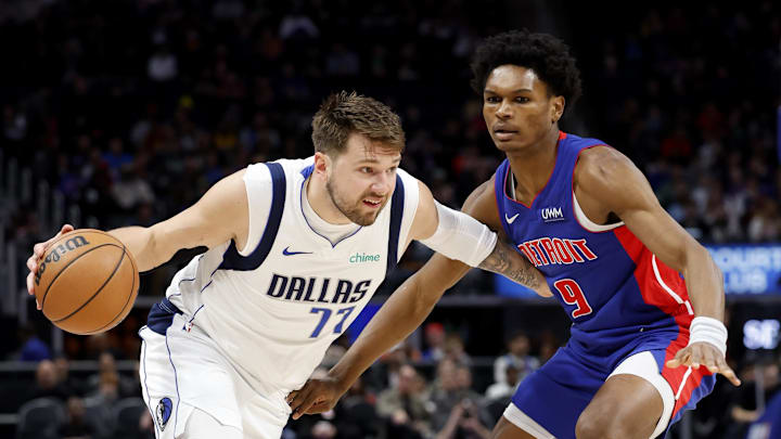 Mar 9, 2024; Detroit, Michigan, USA; Dallas Mavericks guard Luka Doncic (77) dribbles against Detroit Pistons forward Ausar Thompson (9) in the first half at Little Caesars Arena. Mandatory Credit: Rick Osentoski-Imagn Images Mar 9, 2024; Detroit, Michigan, USA; Dallas Mavericks guard Luka Doncic (77) dribbles against Detroit Pistons forward Ausar Thompson (9) in the first half at Little Caesars Arena. Mandatory Credit: Rick Osentoski-Imagn Images
