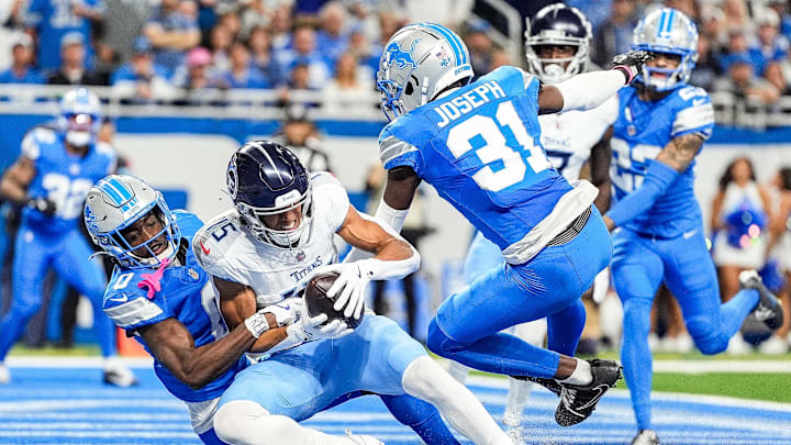 Tennessee Titans wide receiver Nick Westbrook-Ikhine (15) makes a catch for a touchdown against Detroit Lions cornerback Terrion Arnold (0) during the first half at Ford Field in Detroit on Sunday, Oct. 27, 2024.