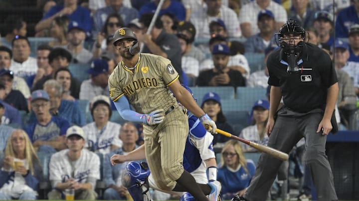 Oct 5, 2024; Los Angeles, California, USA; San Diego Padres shortstop Xander Bogaerts (2) hits a double in the third inning against the Los Angeles Dodgers during game one of the NLDS for the 2024 MLB Playoffs at Dodger Stadium. Mandatory Credit: Jayne Kamin-Oncea-Imagn Images