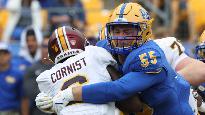 Sep 6, 2025; Pittsburgh, Pennsylvania, USA;  Pittsburgh Panthers defensive lineman Sean FitzSimmons (55) tackles Central Michigan Chippewas running back Trey Cornist (6) during the first quarter at Acrisure Stadium. Mandatory Credit: Charles LeClaire-Imagn Images