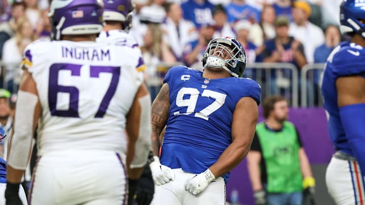 Dec 24, 2022; Minneapolis, Minnesota, USA; New York Giants defensive tackle Dexter Lawrence (97) celebrates a tackle against the Minnesota Vikings during the fourth quarter at U.S. Bank Stadium. Mandatory Credit: Matt Krohn-Imagn Images