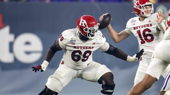 Dec 26, 2024; Phoenix, AZ, USA; Rutgers Scarlet Knights offensive lineman Kwabena Asamoah (69) against the Kansas State Wildcats during the Rate Bowl at Chase Field. Mandatory Credit: Mark J. Rebilas-Imagn Images