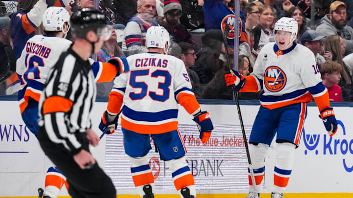 Feb 28, 2026; Columbus, Ohio, USA;  New York Islanders right wing Simon Holmstrom (10) celebrates with teammates after scoring the game-winning goal against the Columbus Blue Jackets in the overtime period at Nationwide Arena. Mandatory Credit: Aaron Doster-Imagn Images