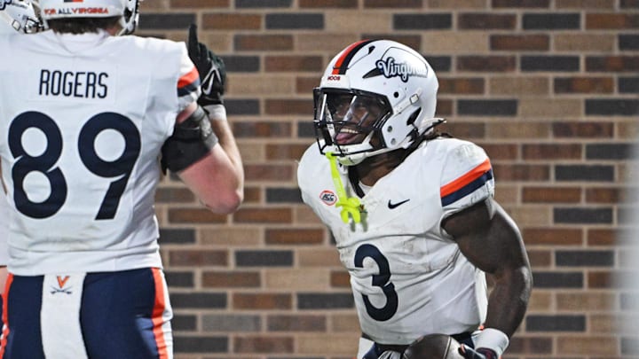 Nov 15, 2025; Durham, North Carolina, USA; Virginia Cavaliers running back J'Mari Taylor (3) celebrates after scoring a touchdown during the third quarter against the Duke Blue Devils at Wallace Wade Stadium. Mandatory Credit: Zachary Taft-Imagn Images Nov 15, 2025; Durham, North Carolina, USA; Virginia Cavaliers running back J'Mari Taylor (3) celebrates after scoring a touchdown during the third quarter against the Duke Blue Devils at Wallace Wade Stadium. Mandatory Credit: Zachary Taft-Imagn Images