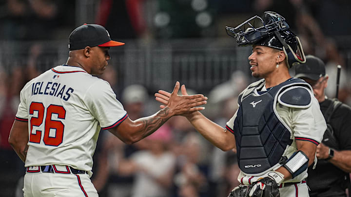 Sep 23, 2025; Cumberland, Georgia, USA; Atlanta Braves relief pitcher Raisel Iglesias (26)  reacts with catcher Drake Baldwin (30) after the Braves defeated the Washington Nationals at Truist Park. Mandatory Credit: Dale Zanine-Imagn Images