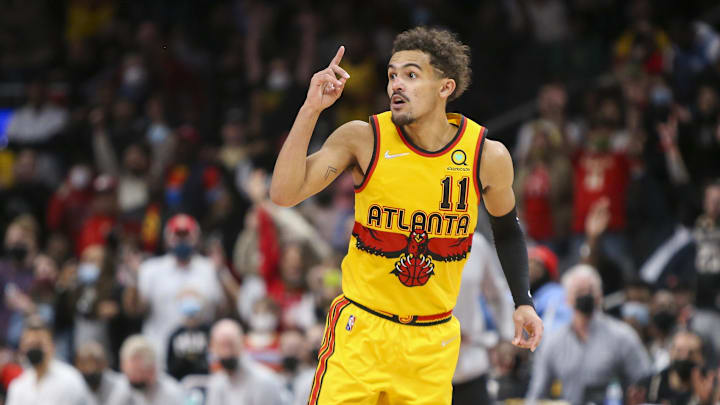 Dec 5, 2021; Atlanta, Georgia, USA; Atlanta Hawks guard Trae Young (11) celebrates after a basket against the Charlotte Hornets in the second half at State Farm Arena. Mandatory Credit: Brett Davis-Imagn Images

