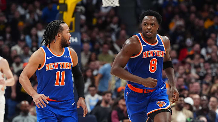 Nov 25, 2024; Denver, Colorado, USA; New York Knicks guard Jalen Brunson (11) reacts towards forward OG Anunoby (8) in the second quarter against the Denver Nuggets at Ball Arena. Mandatory Credit: Ron Chenoy-Imagn Images