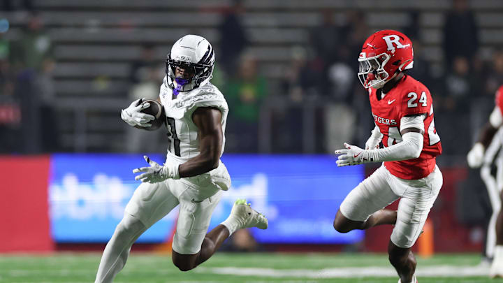 Oct 18, 2025; Piscataway, New Jersey, USA;  Oregon Ducks wide receiver Jeremiah McClellan (11) gains yards after catch as Rutgers Scarlet Knights defensive back Kevin Levy (24) pursues during the second half at SHI Stadium. Mandatory Credit: Vincent Carchietta-Imagn Images