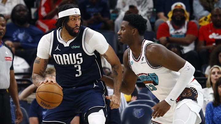 Dallas Mavericks forward Anthony Davis dribbles against Memphis Grizzlies forward Jaren Jackson Jr.