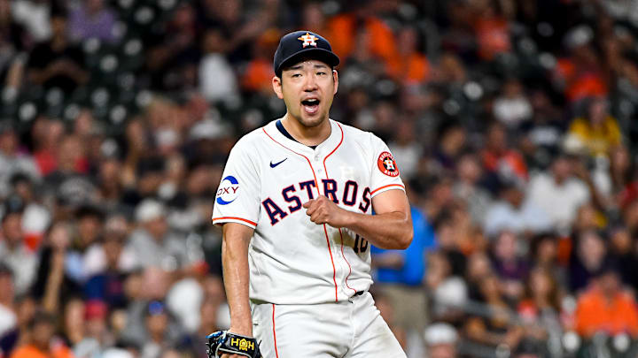 Houston Astros starter Yusei Kikuchi pumps his fist and celebrates on the mound after a strikeout.