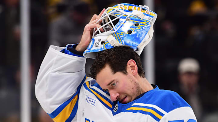 Dec 4, 2025; Boston, Massachusetts, USA; St. Louis Blues goaltender Jordan Binnington (50) slips on his goalie mask during the third period against the Boston Bruins at TD Garden. Mandatory Credit: Bob DeChiara-Imagn Images