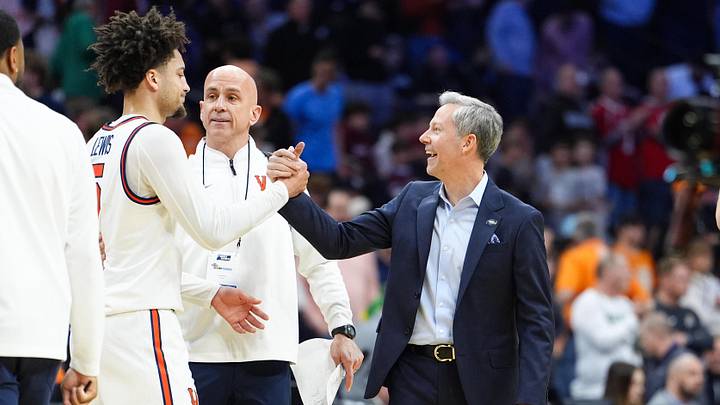 Mar 20, 2026; Philadelphia, PA, USA; Virginia Cavaliers head coach Ryan Odom celebrates with Virginia Cavaliers guard Sam Lewis (5) after the game against the Wright State Raiders during a first round game of the men's 2026 NCAA Tournament at Xfinity Mobile Arena. Mandatory Credit: Kyle Ross-Imagn Images