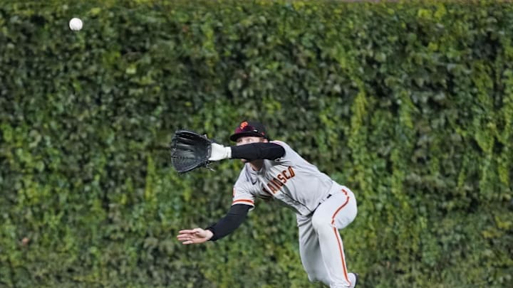 Sep 5, 2023; Chicago, Illinois, USA; San Francisco Giants center fielder Wade Meckler (53) makes a catch on Chicago Cubs shortstop Dansby Swanson (not pictured) during the first inning at Wrigley Field. 