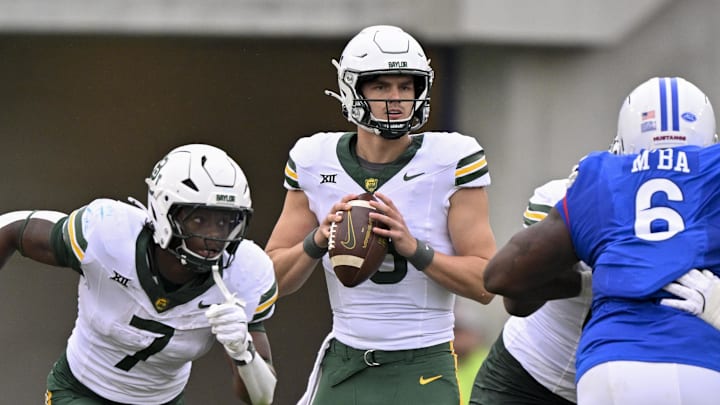 Sep 6, 2025; Dallas, Texas, USA; Baylor Bears quarterback Sawyer Robertson (13) looks to pass the ball against the SMU Mustangs during the second quarter at Gerald J. Ford Stadium. Mandatory Credit: Jerome Miron-Imagn Images Sep 6, 2025; Dallas, Texas, USA; Baylor Bears quarterback Sawyer Robertson (13) looks to pass the ball against the SMU Mustangs during the second quarter at Gerald J. Ford Stadium. Mandatory Credit: Jerome Miron-Imagn Images