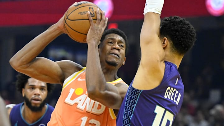 Dec 22, 2025; Cleveland, Ohio, USA; Cleveland Cavaliers forward De'Andre Hunter (12) drives to the basket beside Charlotte Hornets guard Josh Green (10) in the first quarter at Rocket Arena. Mandatory Credit: David Richard-Imagn Images