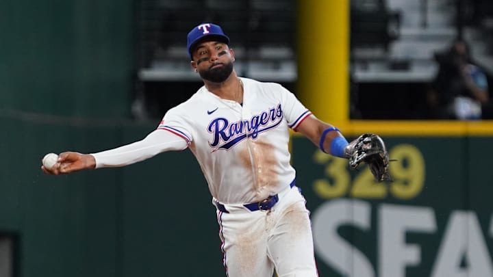 Apr 8, 2026; Arlington, Texas, USA;  Texas Rangers third baseman Ezequiel Duran (20) throws to first base for an out during the second inning against the Seattle Mariners at Globe Life Field. Mandatory Credit: Raymond Carlin III-Imagn Images