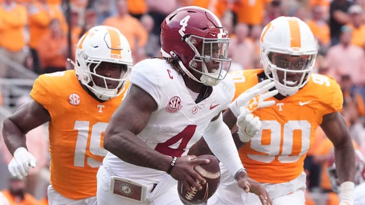 Alabama quarterback Jalen Milroe (4) is pressured by Tennessee defensive linemen Joshua Josephs (19) and Dominic Bailey (90) during an NCAA college football game on Saturday, Oct. 19, 2024, in Knoxville. Tenn.