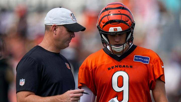 Cincinnati Bengals head coach Zac Taylor talks with quarterback Joe Burrow (9) during the first day of Cincinnati Bengals training camp at the Paycor Stadium practice facility in downtown Cincinnati on Wednesday, July 29, 2026.