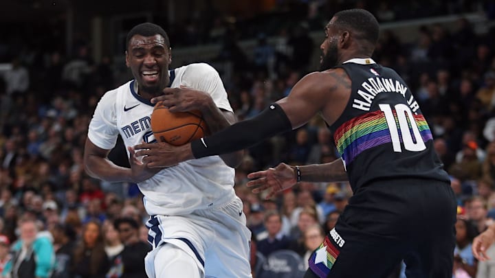 Nov 24, 2025; Memphis, Tennessee, USA; Memphis Grizzlies forward Vince Williams Jr. (5) drives to the basket as Denver Nuggets guard Tim Hardaway Jr. (10) defends during the third quarter at FedExForum. Mandatory Credit: Petre Thomas-Imagn Images