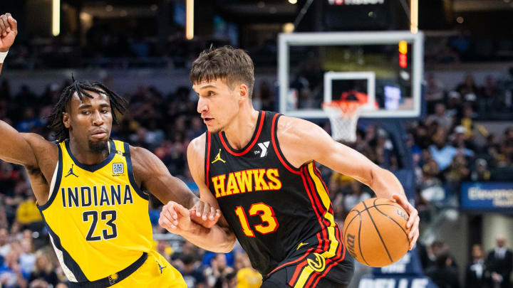 Apr 14, 2024; Indianapolis, Indiana, USA; Atlanta Hawks guard Bogdan Bogdanovic (13) dribbles the ball while Indiana Pacers forward Aaron Nesmith (23) defends in the second half at Gainbridge Fieldhouse. Mandatory Credit: Trevor Ruszkowski-USA TODAY Sports Apr 14, 2024; Indianapolis, Indiana, USA; Atlanta Hawks guard Bogdan Bogdanovic (13) dribbles the ball while Indiana Pacers forward Aaron Nesmith (23) defends in the second half at Gainbridge Fieldhouse. Mandatory Credit: Trevor Ruszkowski-USA TODAY Sports