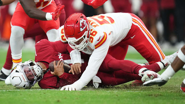 Arizona Cardinals quarterback Kyler Murray (1) is tackled by Kansas City Chiefs defensive end George Karlaftis (56) during their preseason game at State Farm Stadium on Aug. 9, 2025.