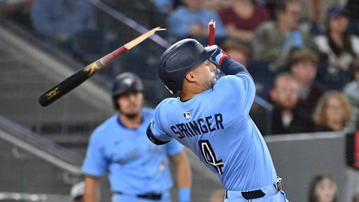 Toronto, Ontario, CAN; Toronto Blue Jays center fielder George Springer (4) breaks his bat grounding out against the Seattle Mariners in the fourth inning at Rogers Centre.