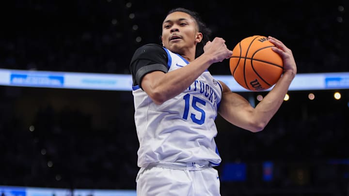 Dec 20, 2025; Atlanta, Georgia, USA; Kentucky Wildcats guard Jaland Lowe (15) grabs a rebound against the St. John Red Storm in the second half at State Farm Arena. Mandatory Credit: Brett Davis-Imagn Images
