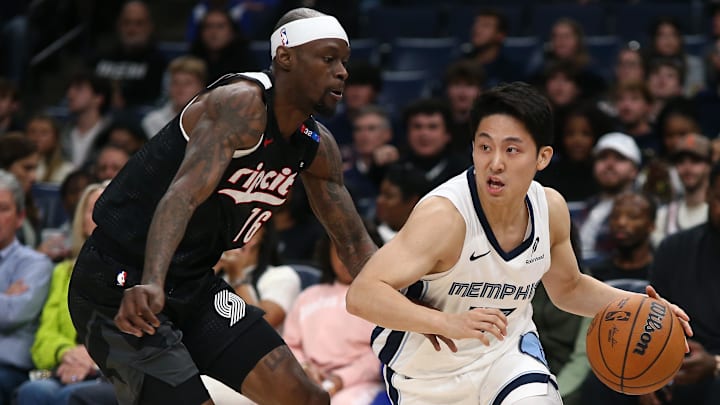 Nov 25, 2024; Memphis, Tennessee, USA; Memphis Grizzlies guard Yuki Kawamura (17) drives to the basket as Portland Trail Blazers guard Taze Moore (76) defends during the second half at FedExForum. Mandatory Credit: Petre Thomas-Imagn Images