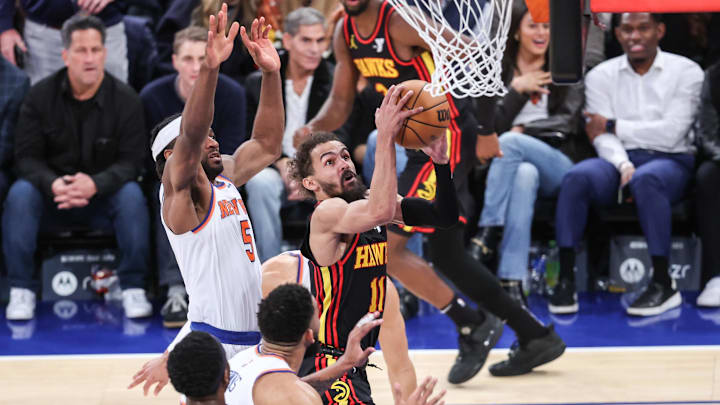 Feb 12, 2025; New York, New York, USA; Atlanta Hawks guard Trae Young (11) drives past New York Knicks forward Precious Achiuwa (5) in the fourth quarter at Madison Square Garden. Mandatory Credit: Wendell Cruz-Imagn Images Feb 12, 2025; New York, New York, USA; Atlanta Hawks guard Trae Young (11) drives past New York Knicks forward Precious Achiuwa (5) in the fourth quarter at Madison Square Garden. Mandatory Credit: Wendell Cruz-Imagn Images
