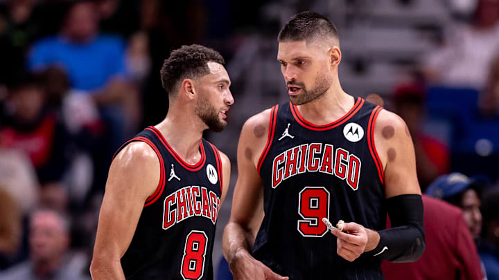 Oct 23, 2024; New Orleans, Louisiana, USA;  Chicago Bulls guard Zach LaVine (8) and center Nikola Vucevic (9) talk on a time out against the New Orleans Pelicans during the first half at Smoothie King Center. Mandatory Credit: Stephen Lew-Imagn Images