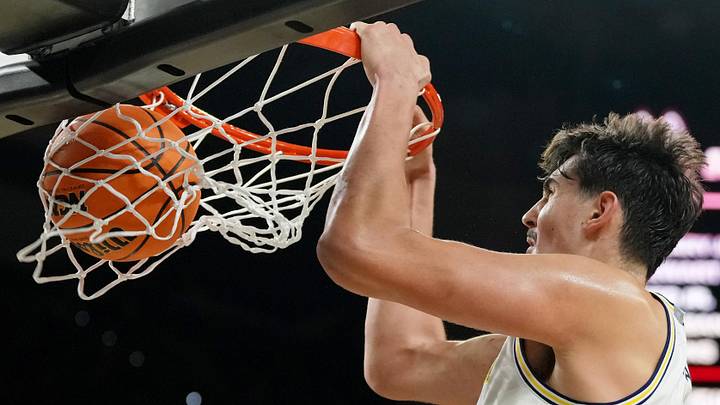 Apr 6, 2026; Indianapolis, IN, USA; Michigan Wolverines center Aday Mara (15) dunks against the UConn Huskies during the second half in the national championship of the Final Four of the men's 2026 NCAA Tournament between the and the Michigan Wolverines at Lucas Oil Stadium. Apr 6, 2026; Indianapolis, IN, USA; Michigan Wolverines center Aday Mara (15) dunks against the UConn Huskies during the second half in the national championship of the Final Four of the men's 2026 NCAA Tournament between the and the Michigan Wolverines at Lucas Oil Stadium.